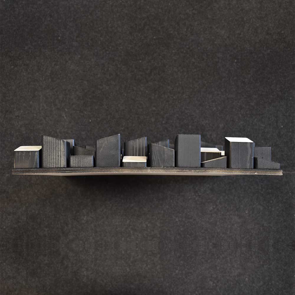 Blocchetti in legno chiaro e nero di un pannello Skyline